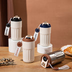 Set of white Smart Insulated Coffee Cup with different colored lids on a wooden surface.
