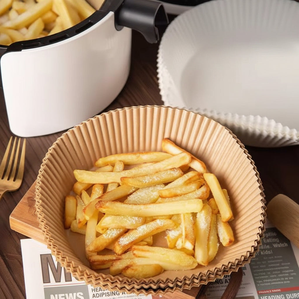 French fries in a paper bowl on a waterproof, oil-resistant, and non-stick air fryer paper tray.