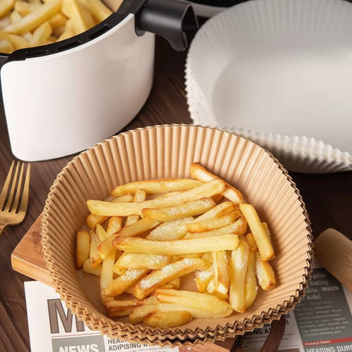 French fries in a paper bowl on a waterproof, oil-resistant, and non-stick air fryer paper tray.