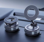 Two metallic car vacuum magnetic phone  holders with circular ring-shaped tops and suction-style bases, shown resting on a dark car dashboard.